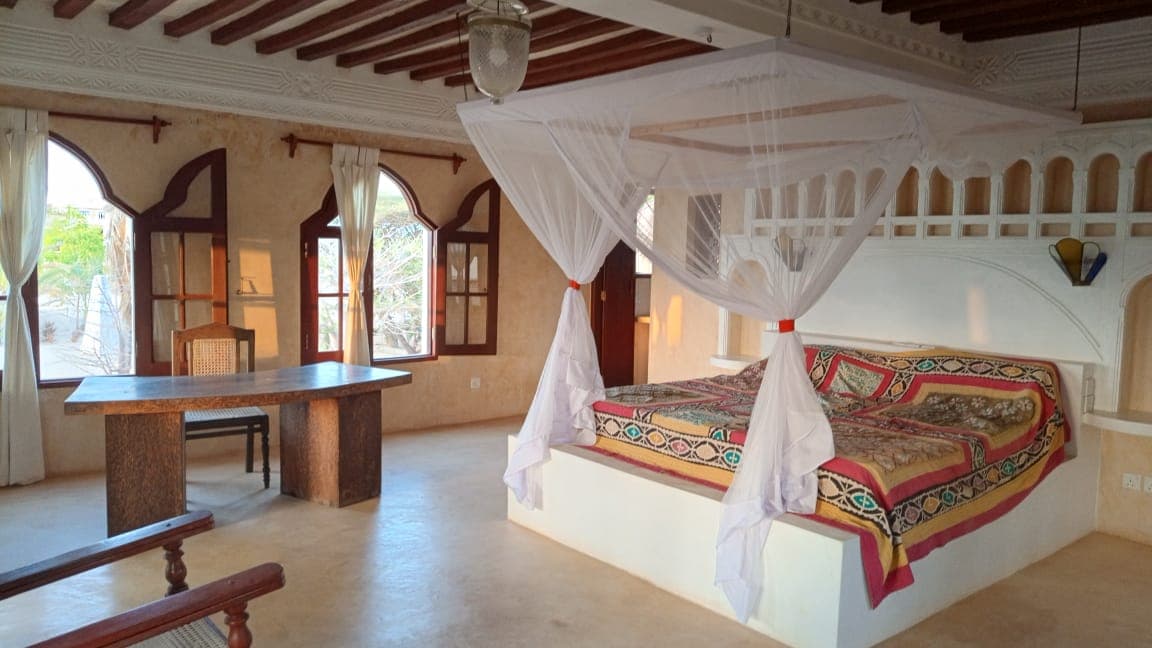 Bedroom at Little Red Moon House with ocean-inspired tones