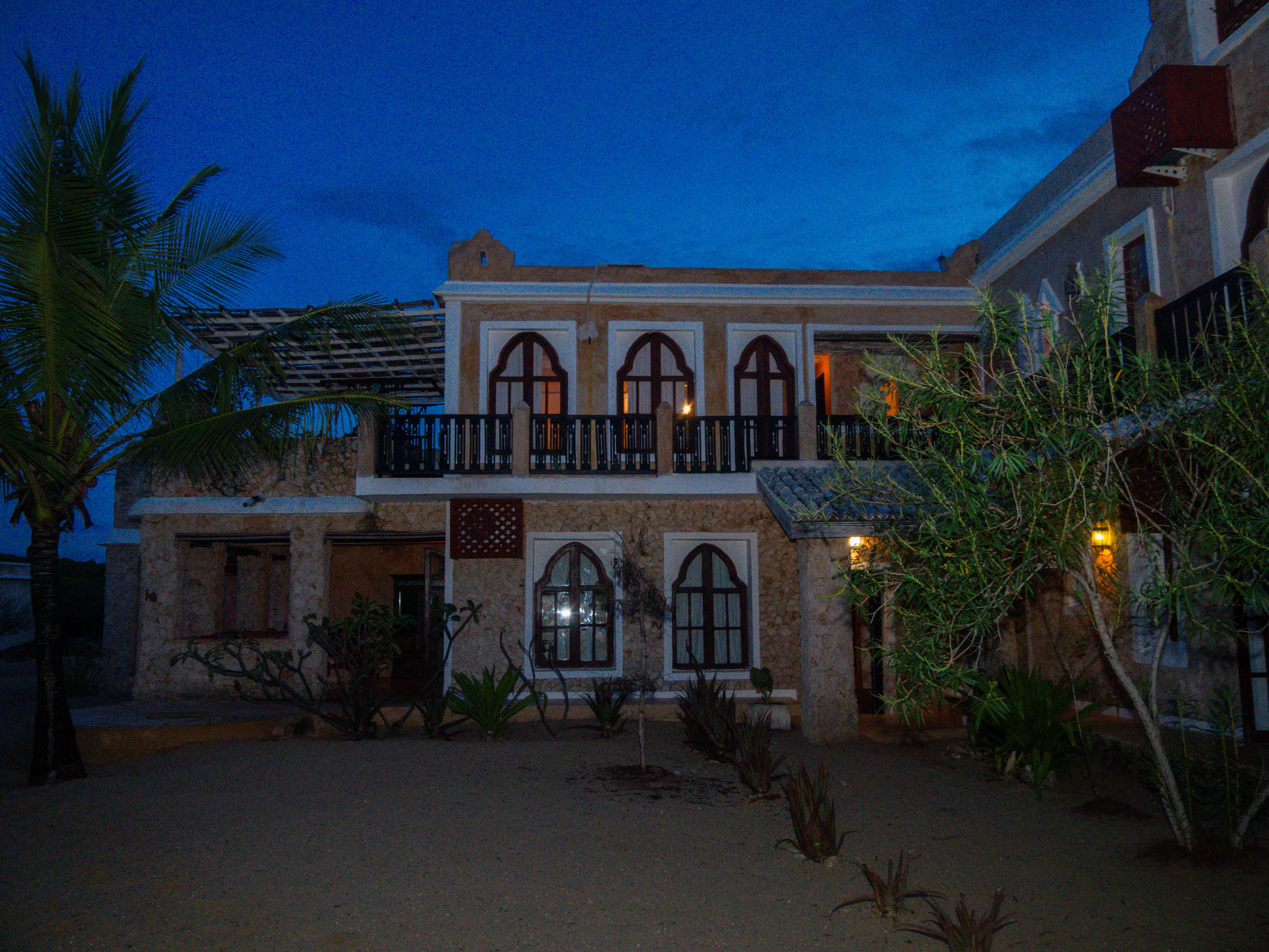 Main villa illuminated at night