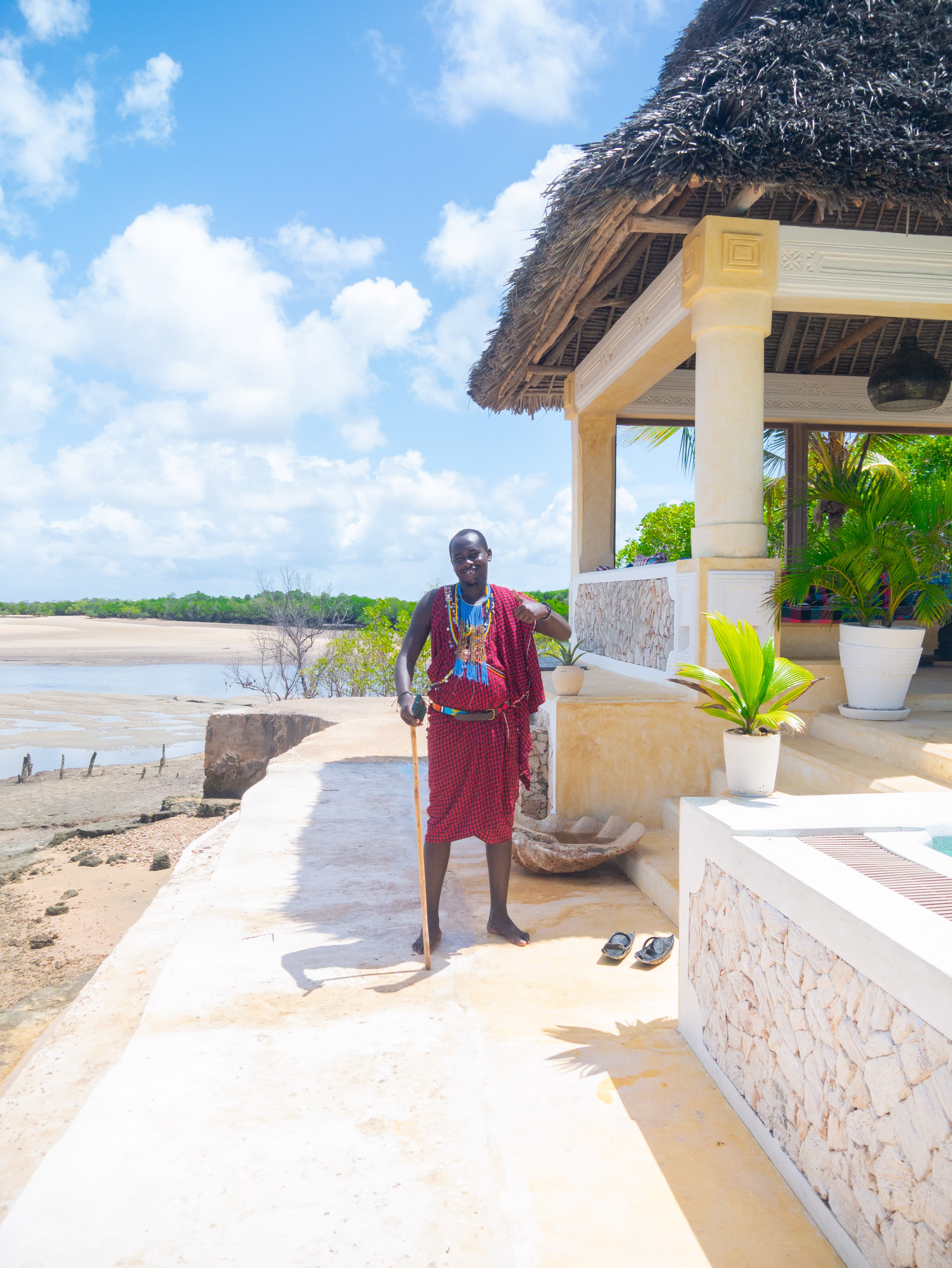 Staff by the gazebo with sea backdrop