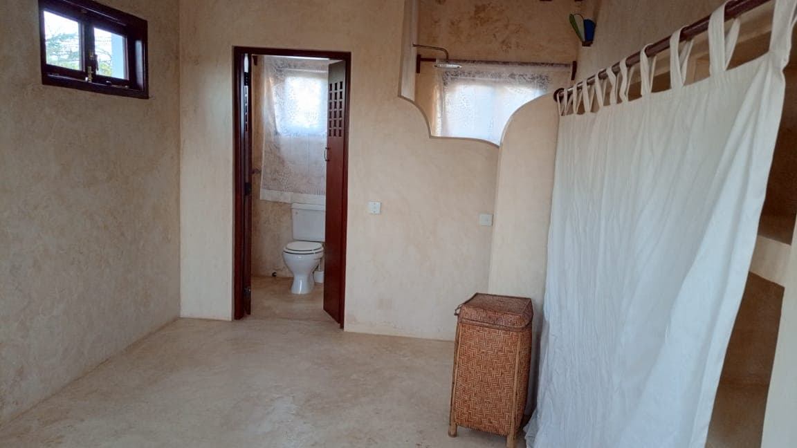 Full bathroom view in Little Red Moon House